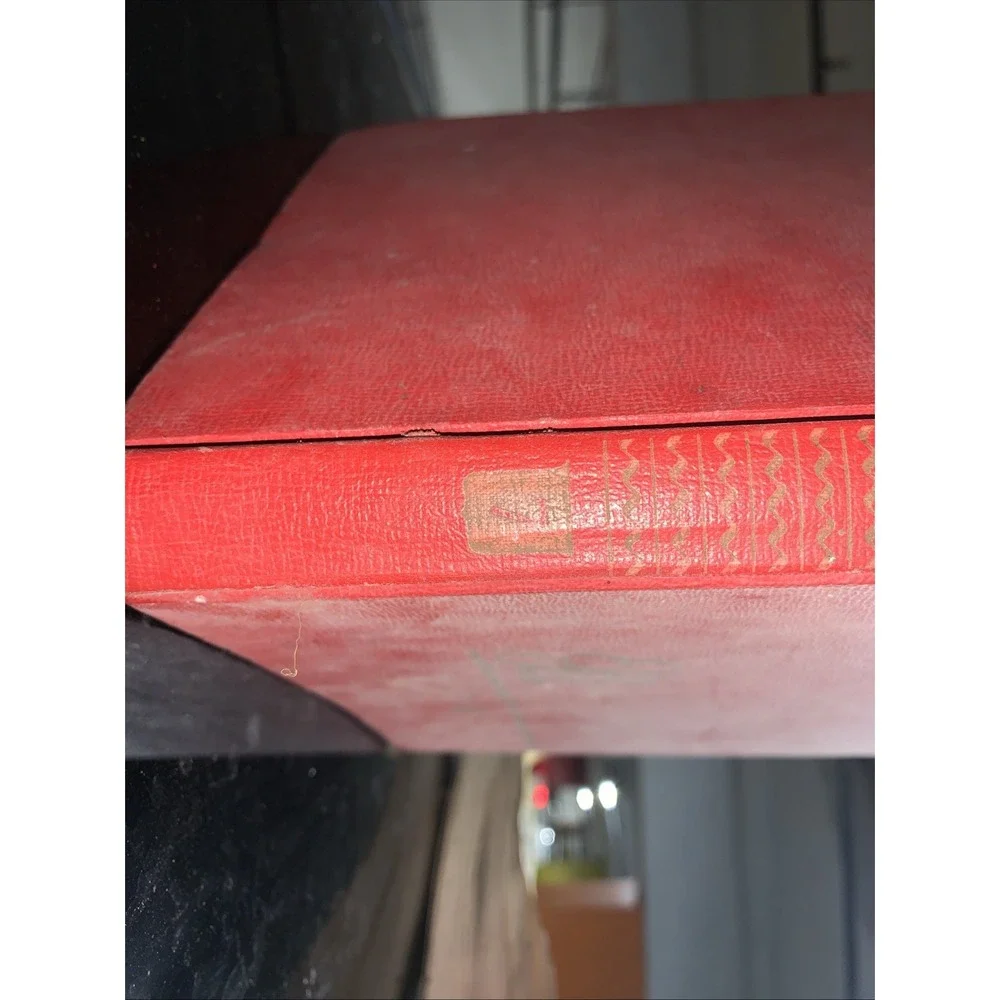 Volume 7 (H) of the vintage red and gold Britannica Junior Encyclopædia